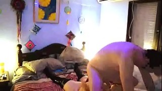 Fat black chick sucks white dude's dick while second dude fucks her from behind