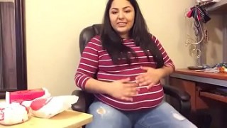 Obese woman bloats and plays with her gigantic belly