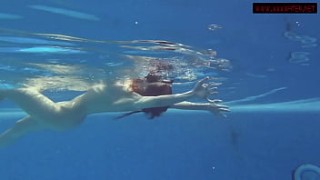 Sexy babes with big tits swim underwater in the pool