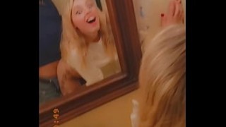Cutie masturbates on mirror